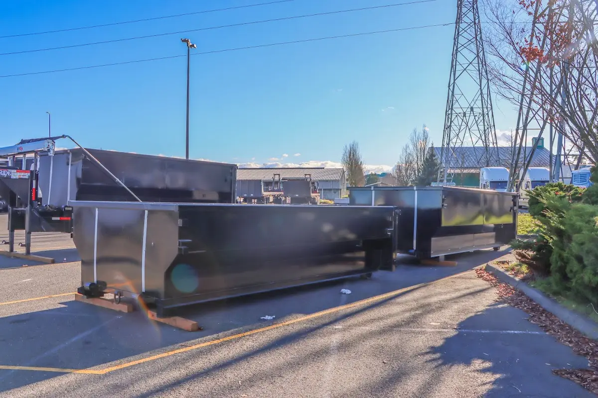 Roll-off dumpster ready for waste disposal at job site for Concrete Dumpster Rental in New Canaan